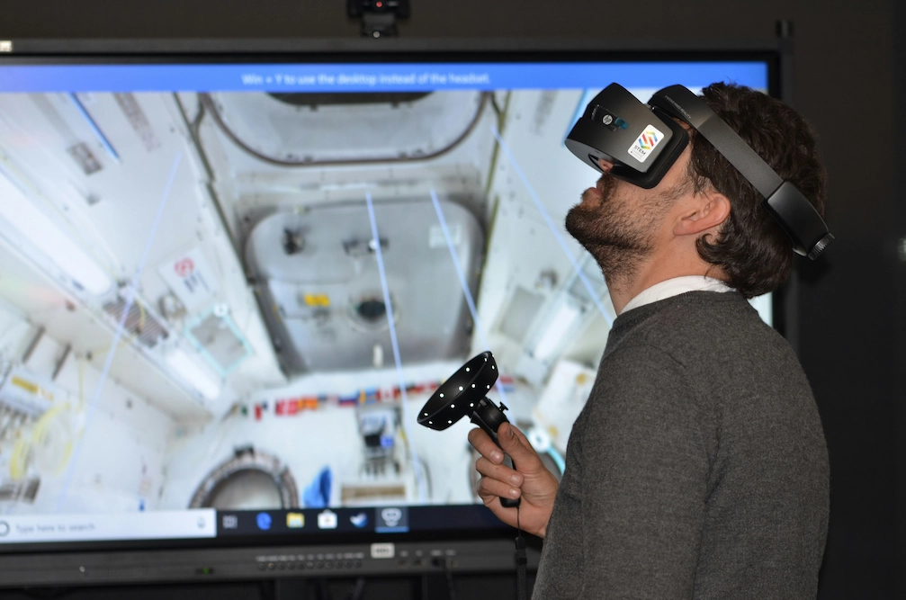 A man with an enterprise VR headset